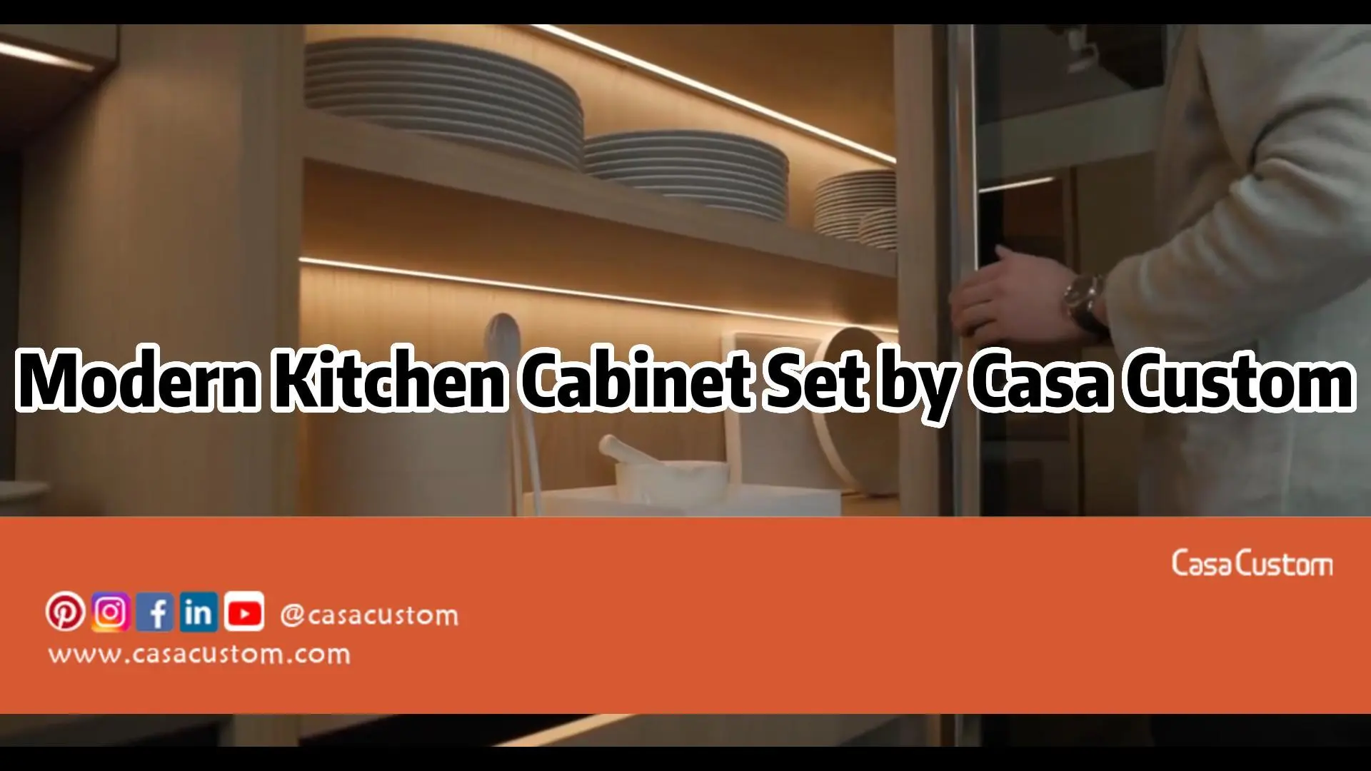 Casa Custom modern kitchen cabinet set features sintered stone countertop metal pull-out baskets and a sliding door pantry with glass doors.